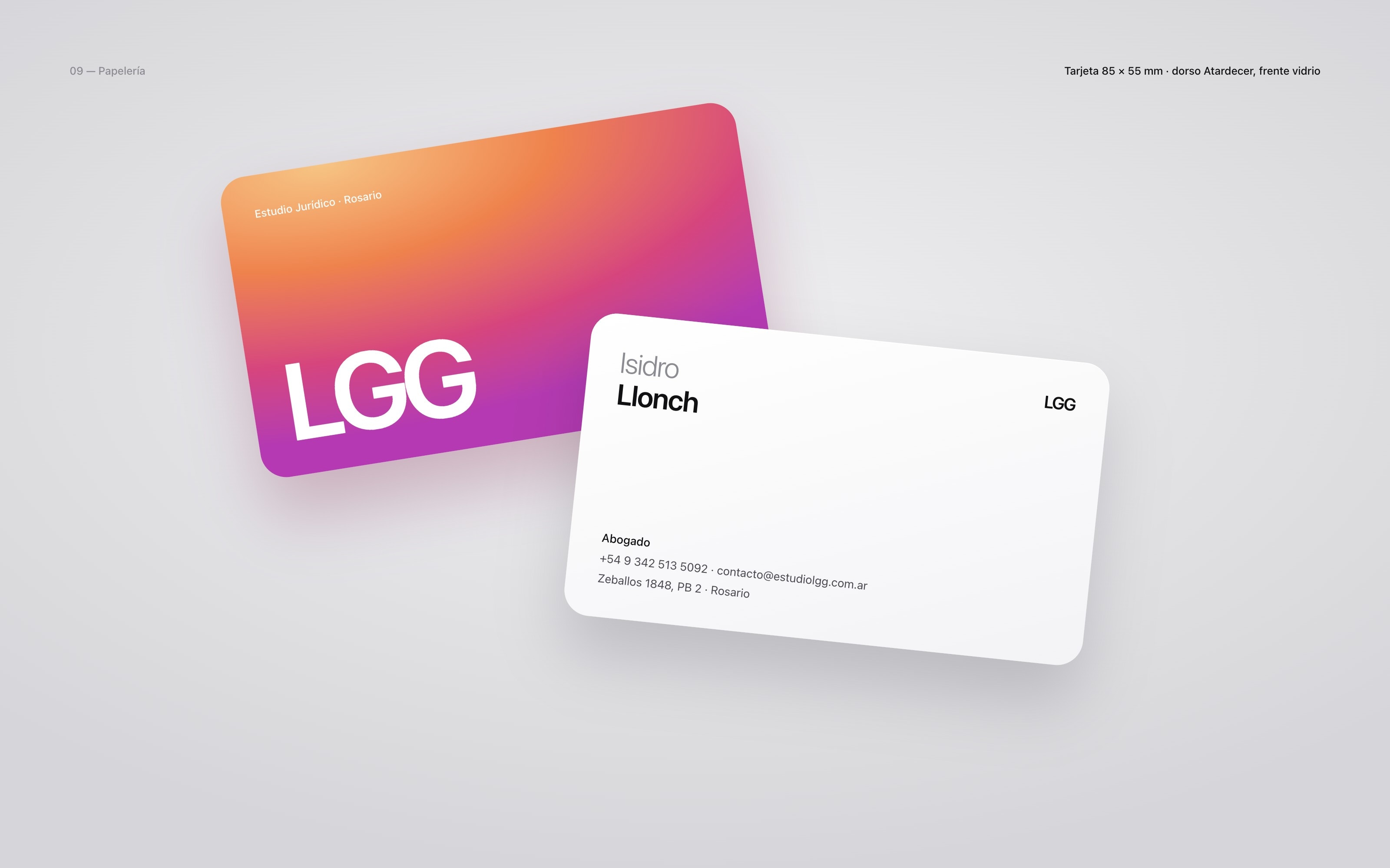 Two business cards, the gradient back with the logotype and the white front with a lawyer's details.